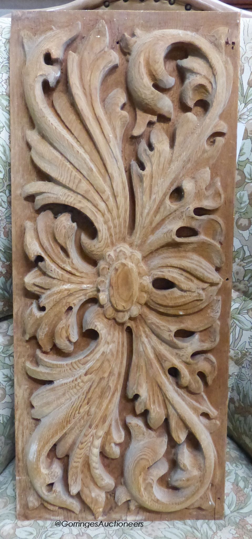 A rectangular carved oak panel, 30 x 72cm